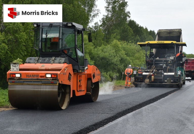 Installation of asphalt paving for a durable driveway.